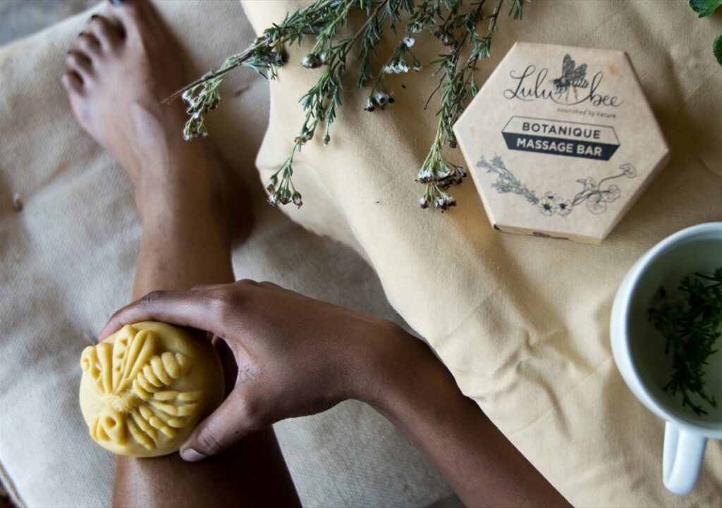Showing the many ways how to use the Botanique Massage Bar. Applying the moisturising massage balm to leg